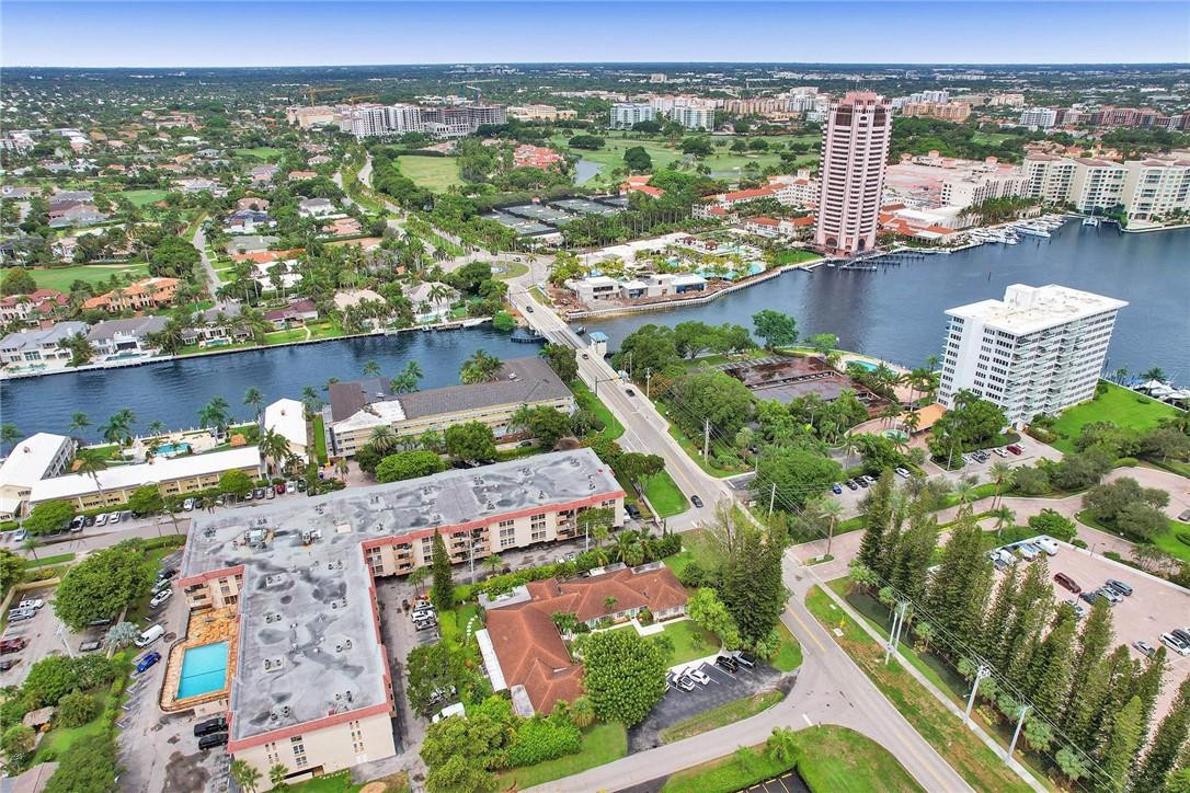 770 East Camino Real, Unit 3 Boca Raton, FL 33432 - Photo 32 of 34 an aerial view of a city with lots of residential buildings ocean and mountain view in back