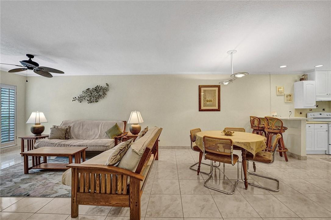 770 East Camino Real, Unit 3 Boca Raton, FL 33432 - Photo 8 of 34 a living room with furniture and wooden floor