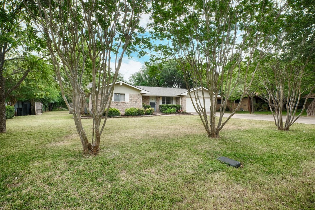 a house with trees in the background