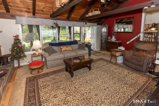 a living room with furniture and a rug