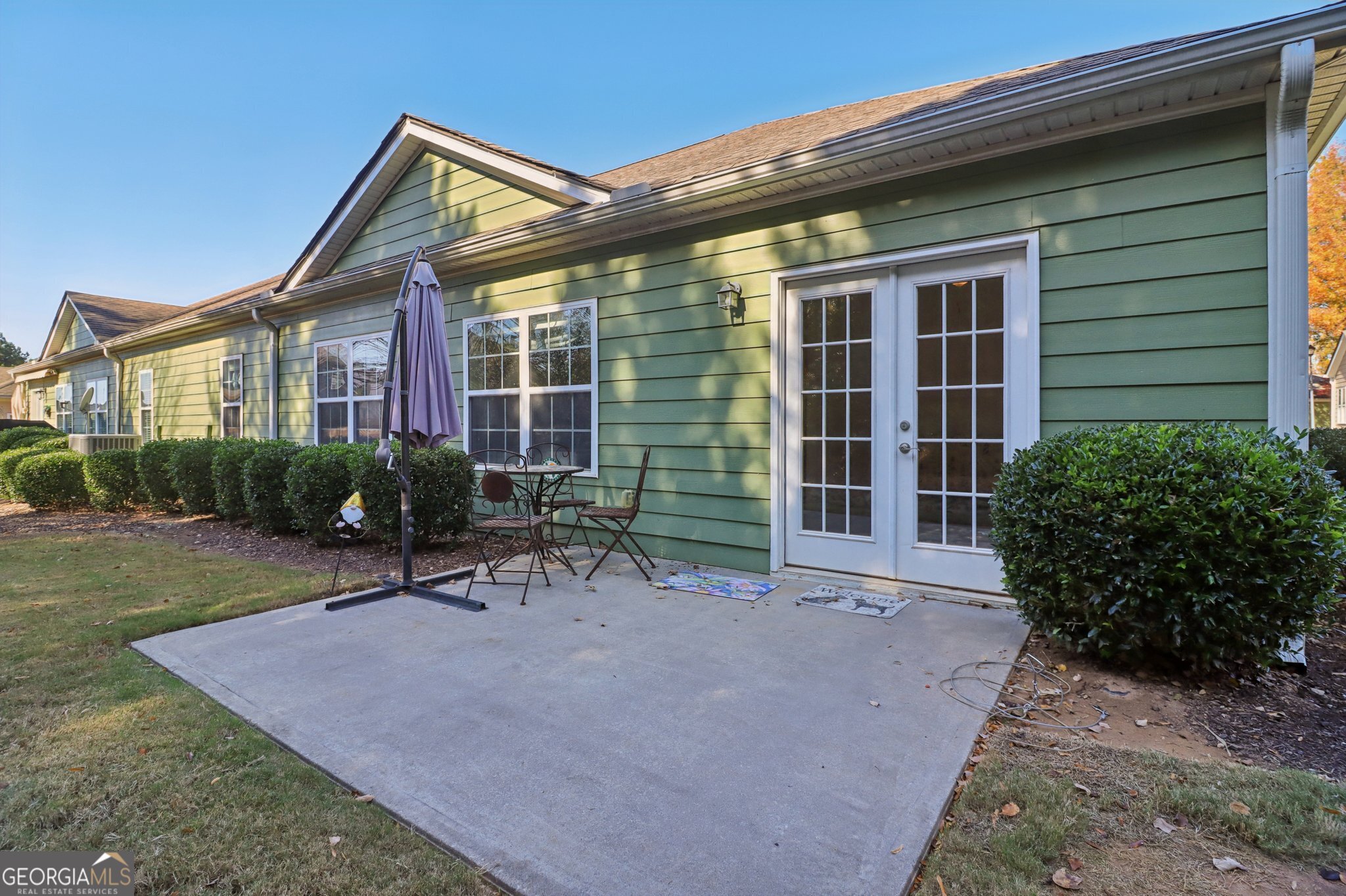 1502 Commonwealth Circle Newnan, GA 30263 - Photo 25 of 30 a view of a house with backyard and sitting area
