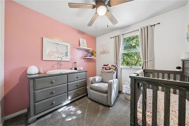 a bedroom with furniture and a window