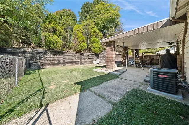 a view of a backyard with sitting area