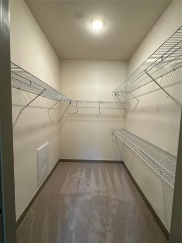 a view of a room with racks on the wall