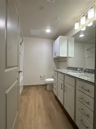 a bathroom with a shower and a bath tub