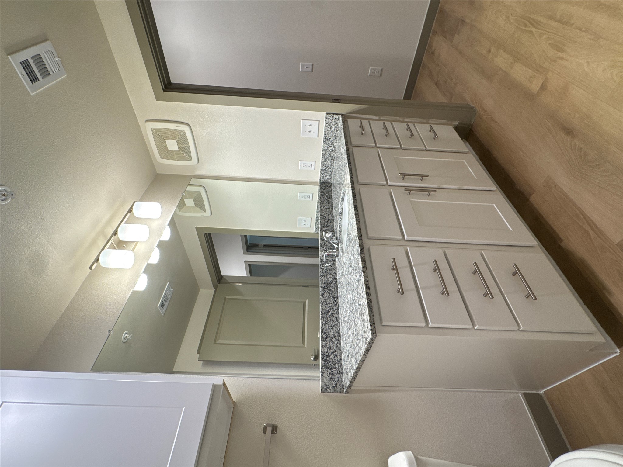 691 Union Chapel Road, Unit C1 Cedar Creek, TX 78612 - Photo 19 of 35 a bathroom with a granite countertop sink and a mirror