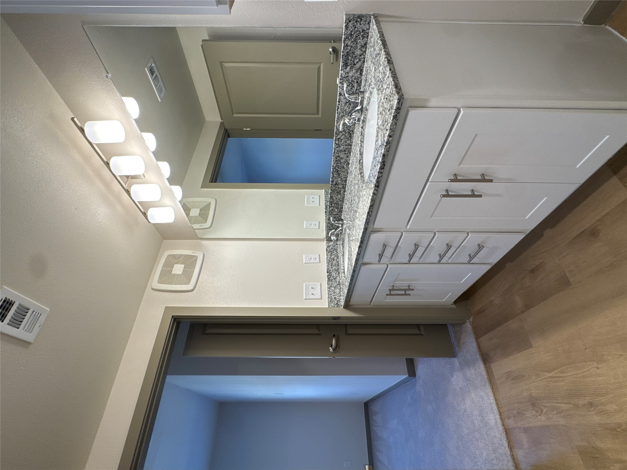 691 Union Chapel Road, Unit C1 Cedar Creek, TX 78612 - Photo 20 of 35 a bathroom with a granite countertop sink and a large mirror