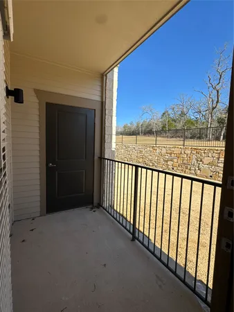 a view of kitchen and refrigerator
