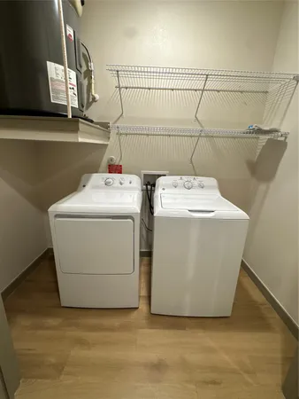 a view of an empty room and a window