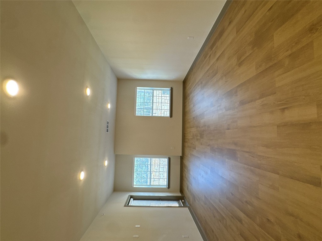 691 Union Chapel Road, Unit C1 Cedar Creek, TX 78612 - Photo 4 of 35 Living room featuring light wood-style floors and recessed lighting