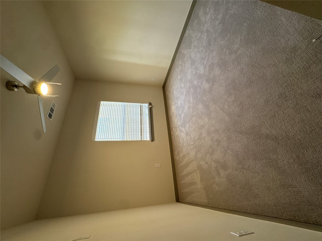 691 Union Chapel Road, Unit C1 Cedar Creek, TX 78612 - Photo 6 of 35 Bedroom featuring carpet and a ceiling fan