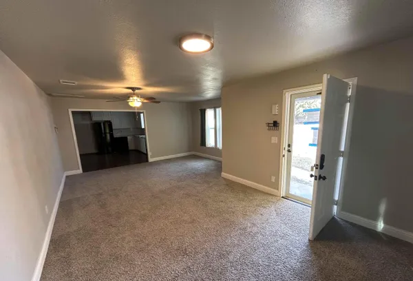 a view of an empty room with a window