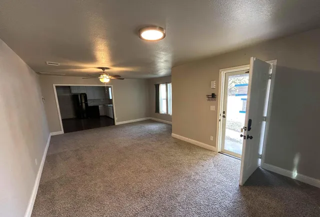 a view of an empty room with a window