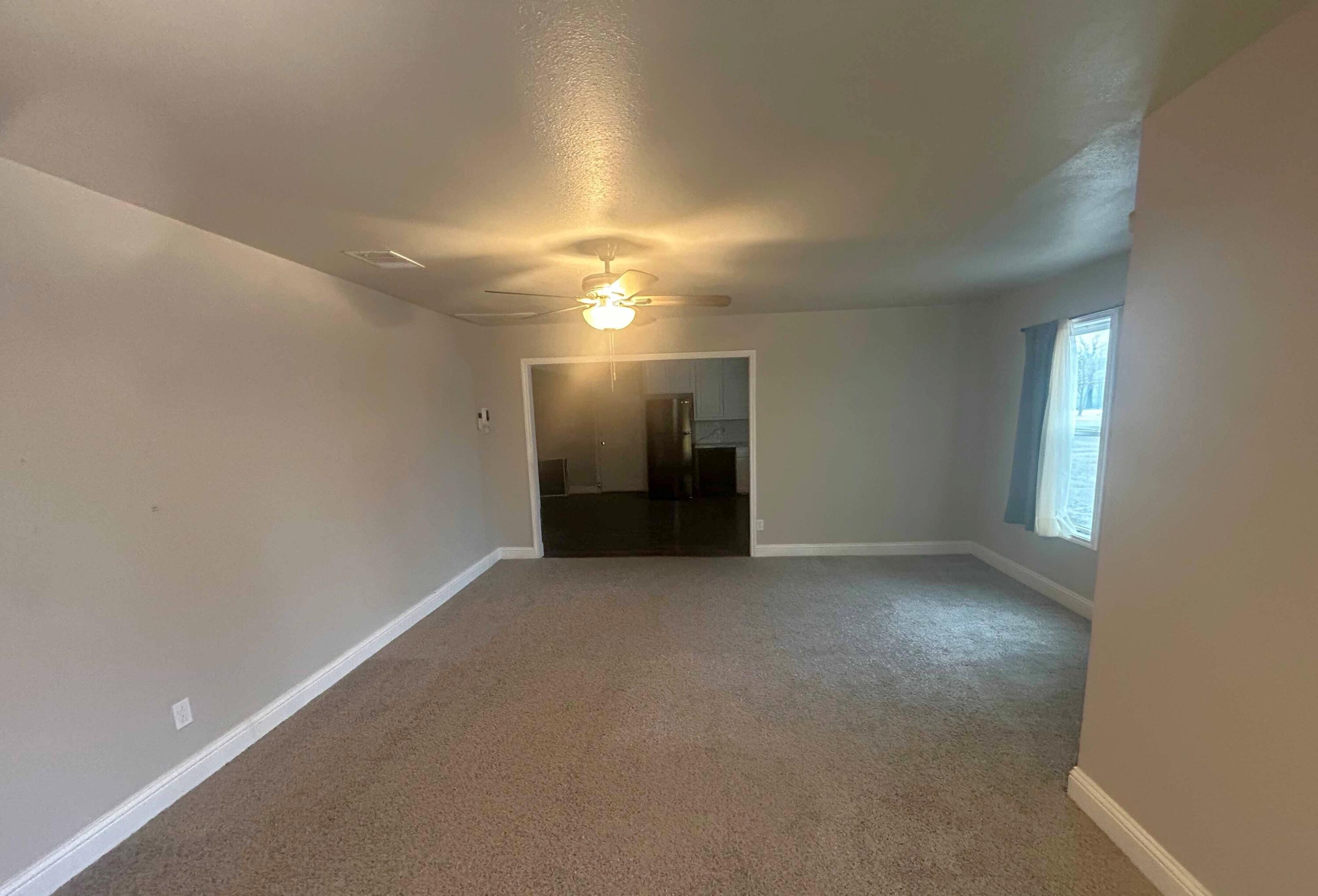 2221 39th Street Lubbock, TX 79412 - Photo 3 of 17 a view of an empty room with a window