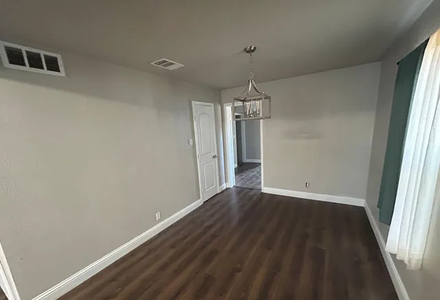a view of a chandelier fan in a room