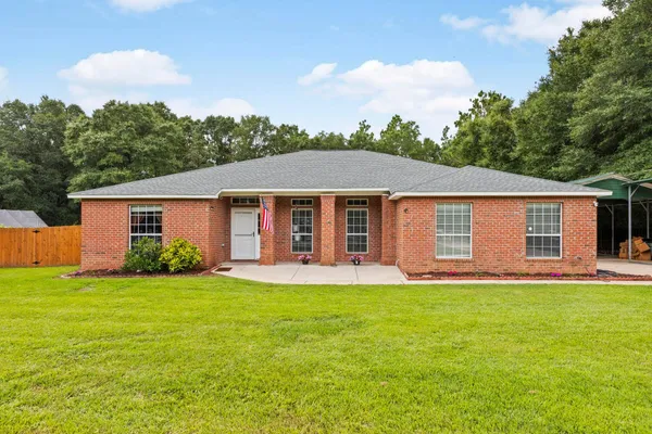 front view of a house and a yard