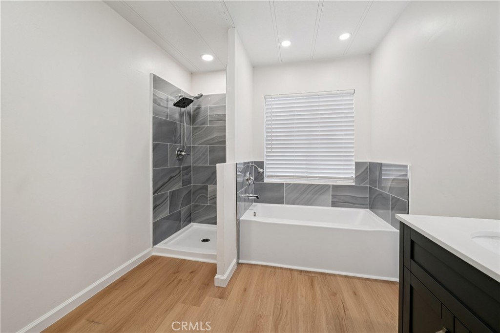 3663 Buchanan Street, Unit 130 Riverside, CA 92503 - Photo 18 of 26 a bathroom with a bathtub and a shower