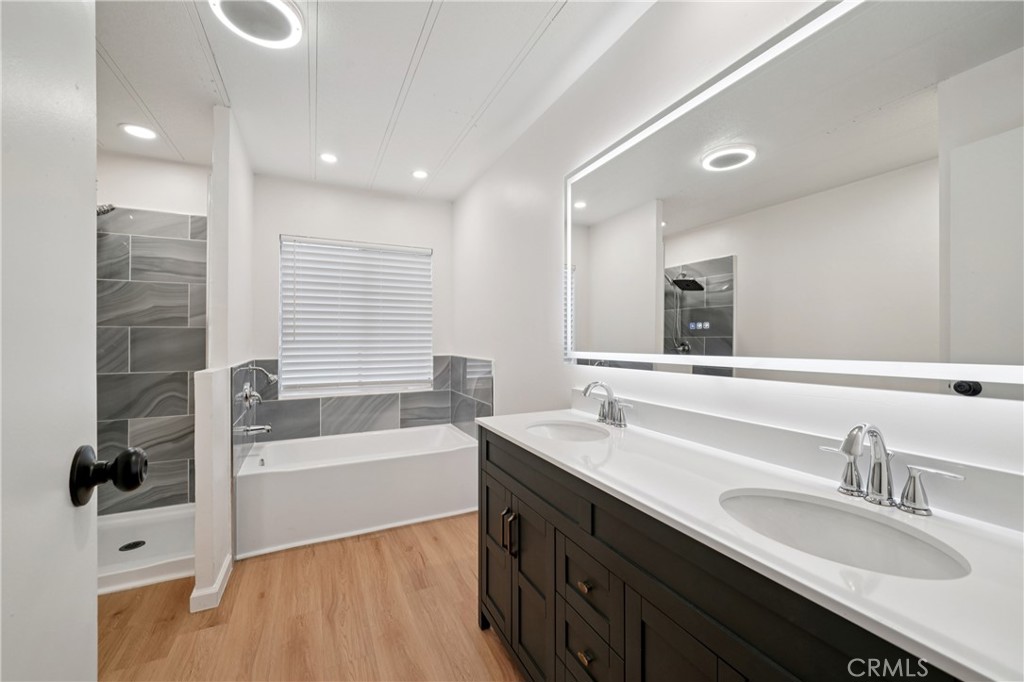 3663 Buchanan Street, Unit 130 Riverside, CA 92503 - Photo 19 of 26 a bathroom with a tub double sink window and mirror