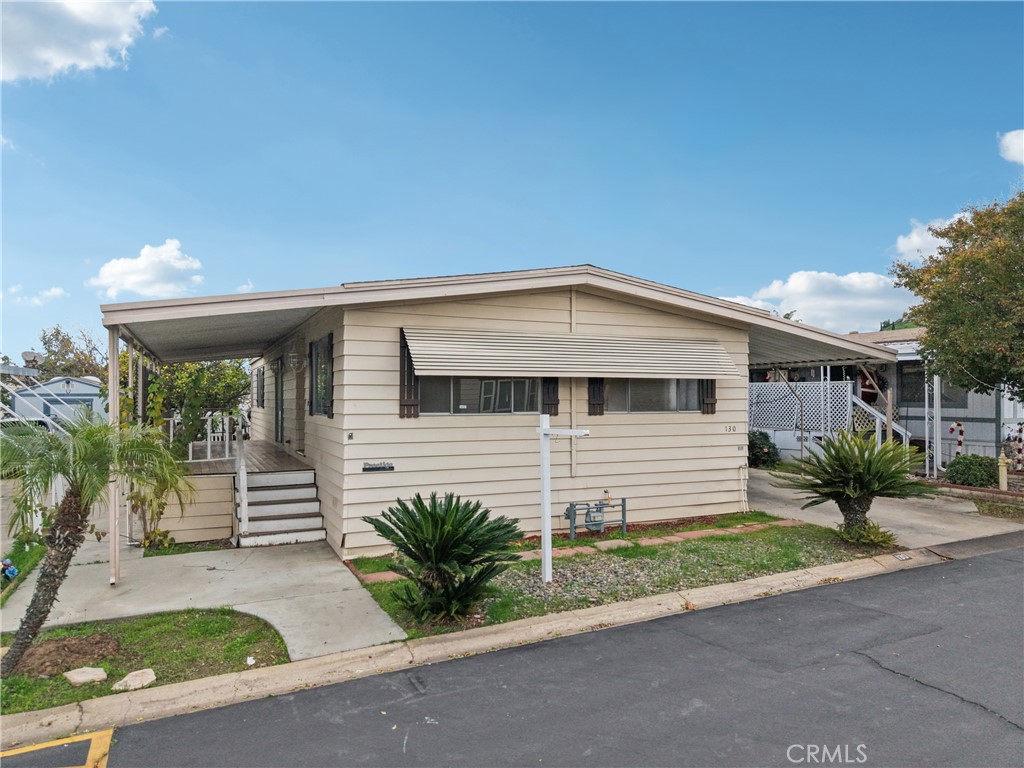3663 Buchanan Street, Unit 130 Riverside, CA 92503 - Photo 24 of 26 a front view of a house with a yard