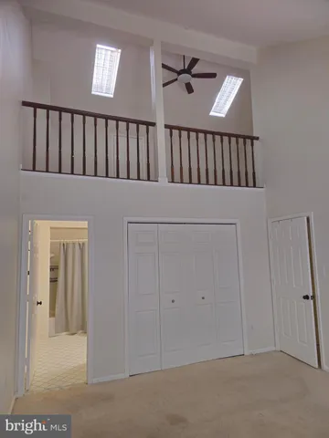 a view of staircase with white walls