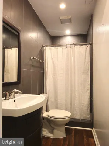 a view of a utility room with wooden walls