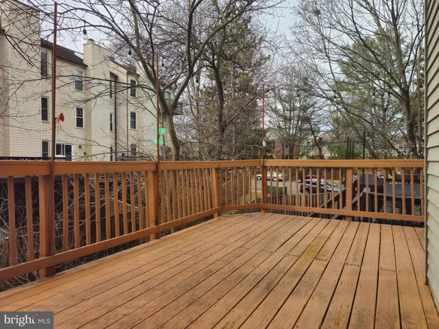 a view of deck with wooden floor and fence