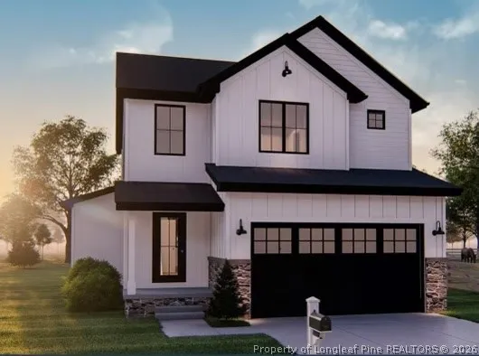 a front view of a house with garage
