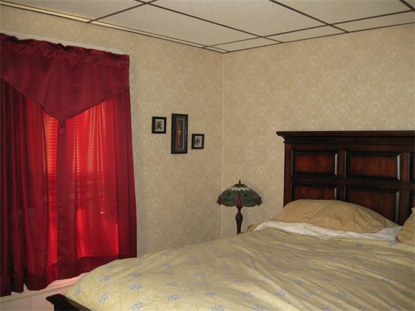 497 Ridge Street Fall River, MA 02724 - Photo 18 of 20 a bedroom with a bed and a dresser