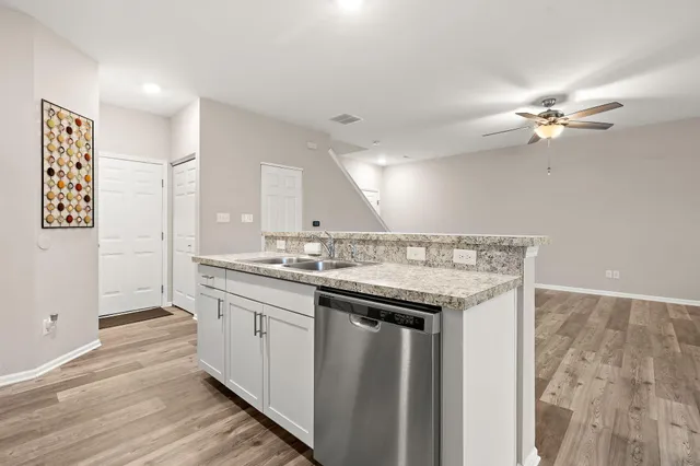 a kitchen with a sink and a refrigerator