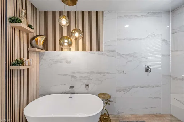 a bathroom with a sink a mirror and a shower