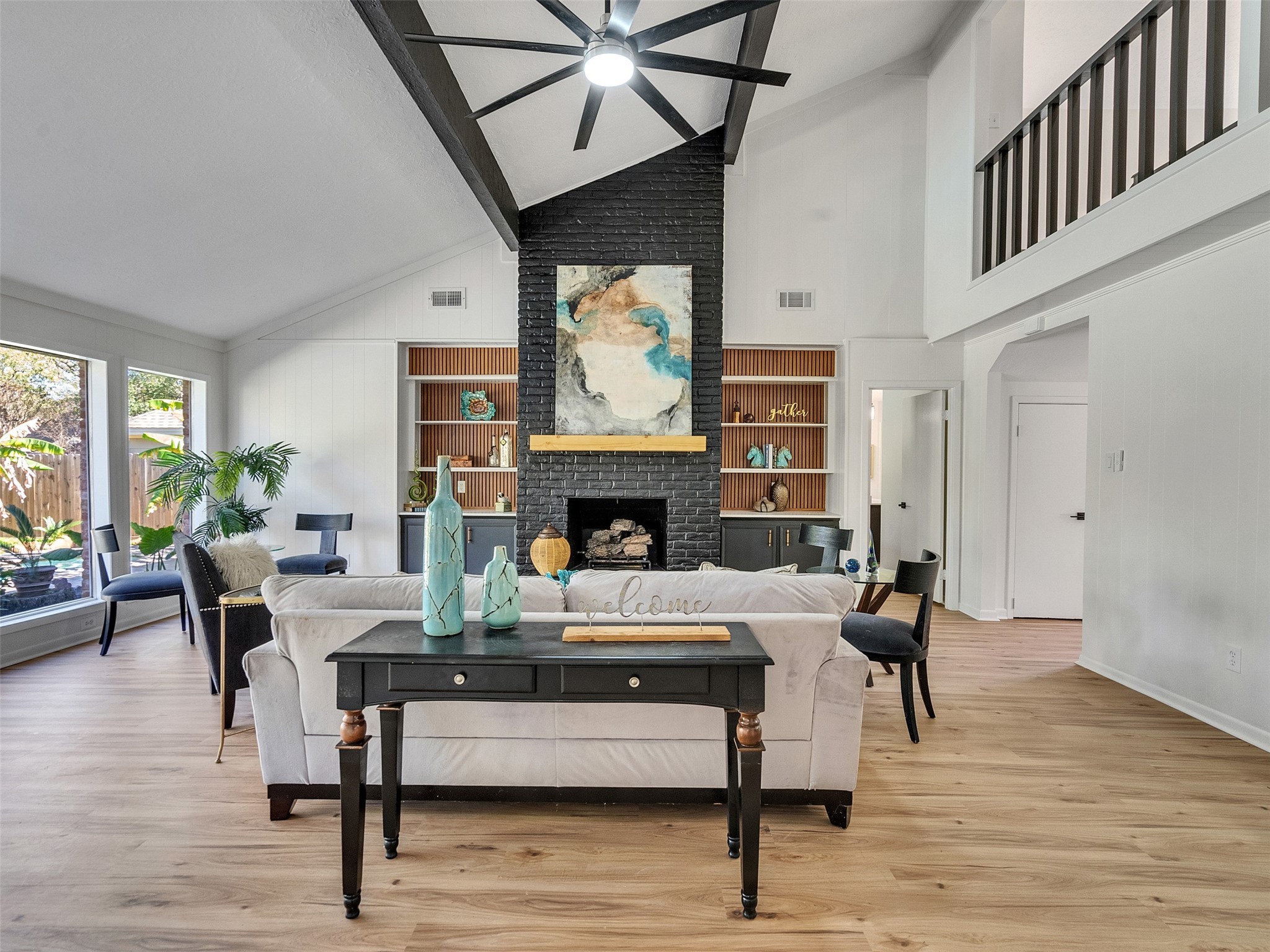 6510 Knollview Drive Spring, TX 77389 - Photo 14 of 43 a living room with furniture a large window and a fireplace