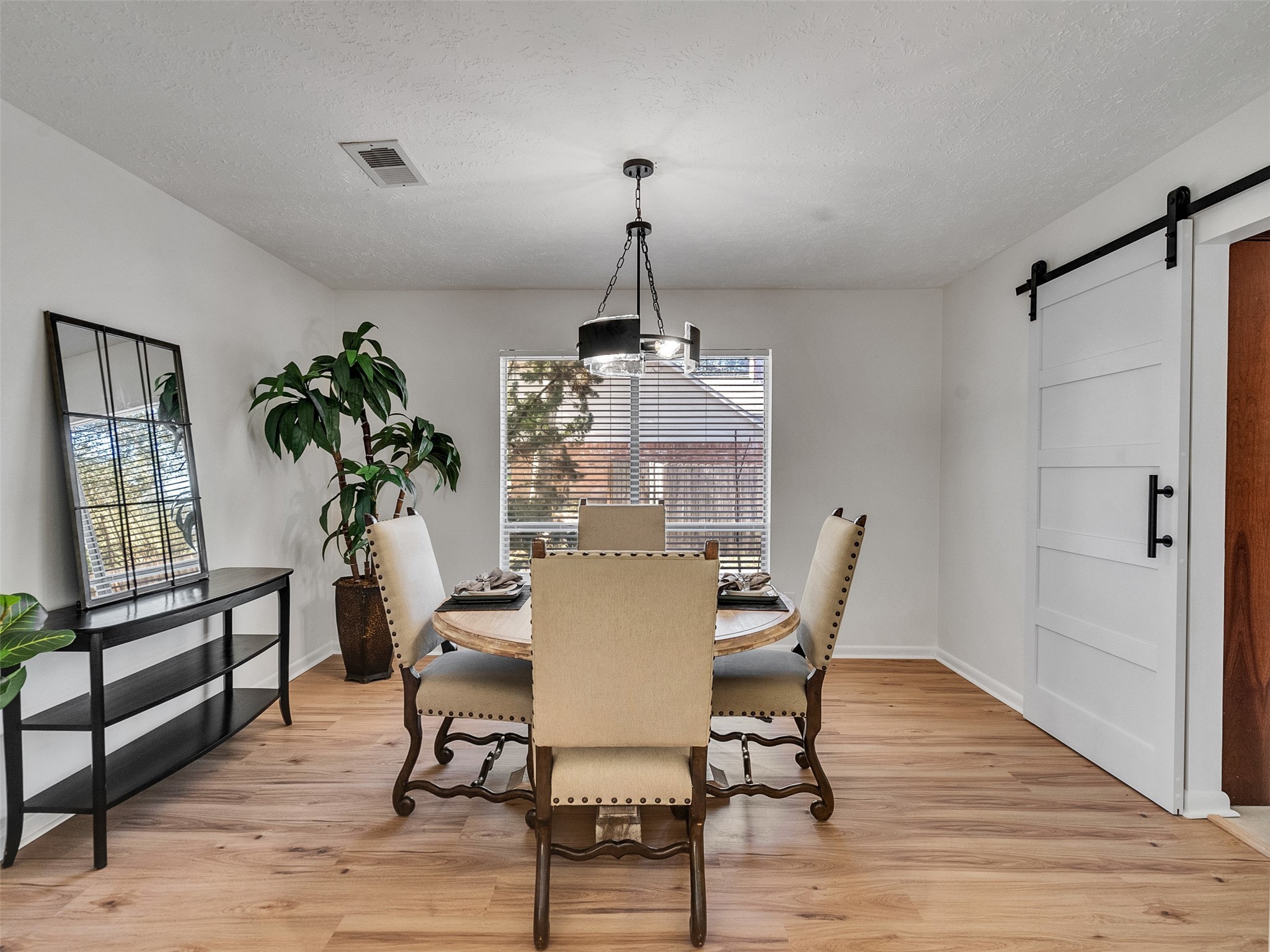 6510 Knollview Drive Spring, TX 77389 - Photo 20 of 43 a view of a dining room with furniture window and wooden floor