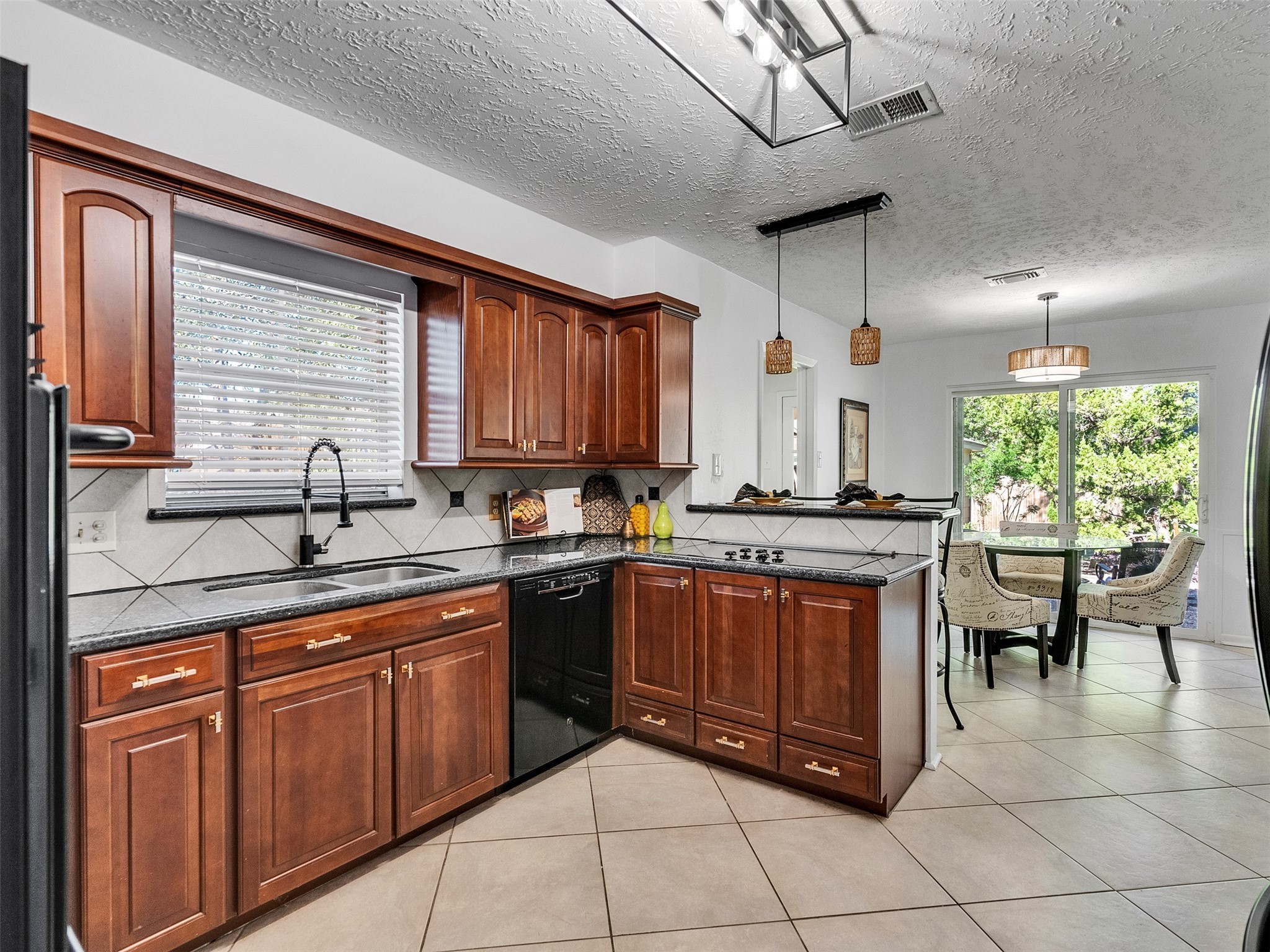 6510 Knollview Drive Spring, TX 77389 - Photo 26 of 43 a kitchen with stainless steel appliances granite countertop a sink and cabinets