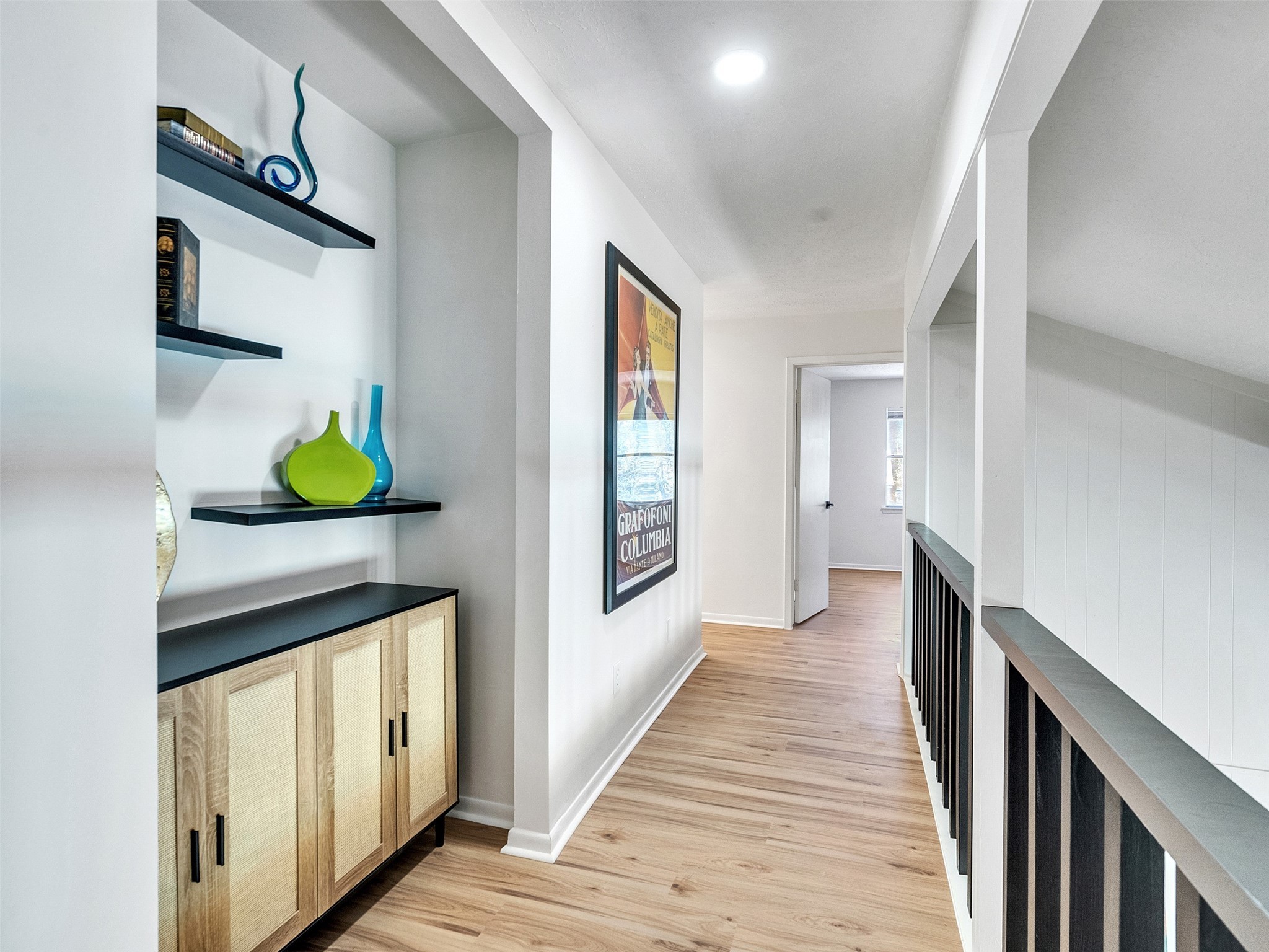 6510 Knollview Drive Spring, TX 77389 - Photo 35 of 43 a hallway with painting on the wall and a window