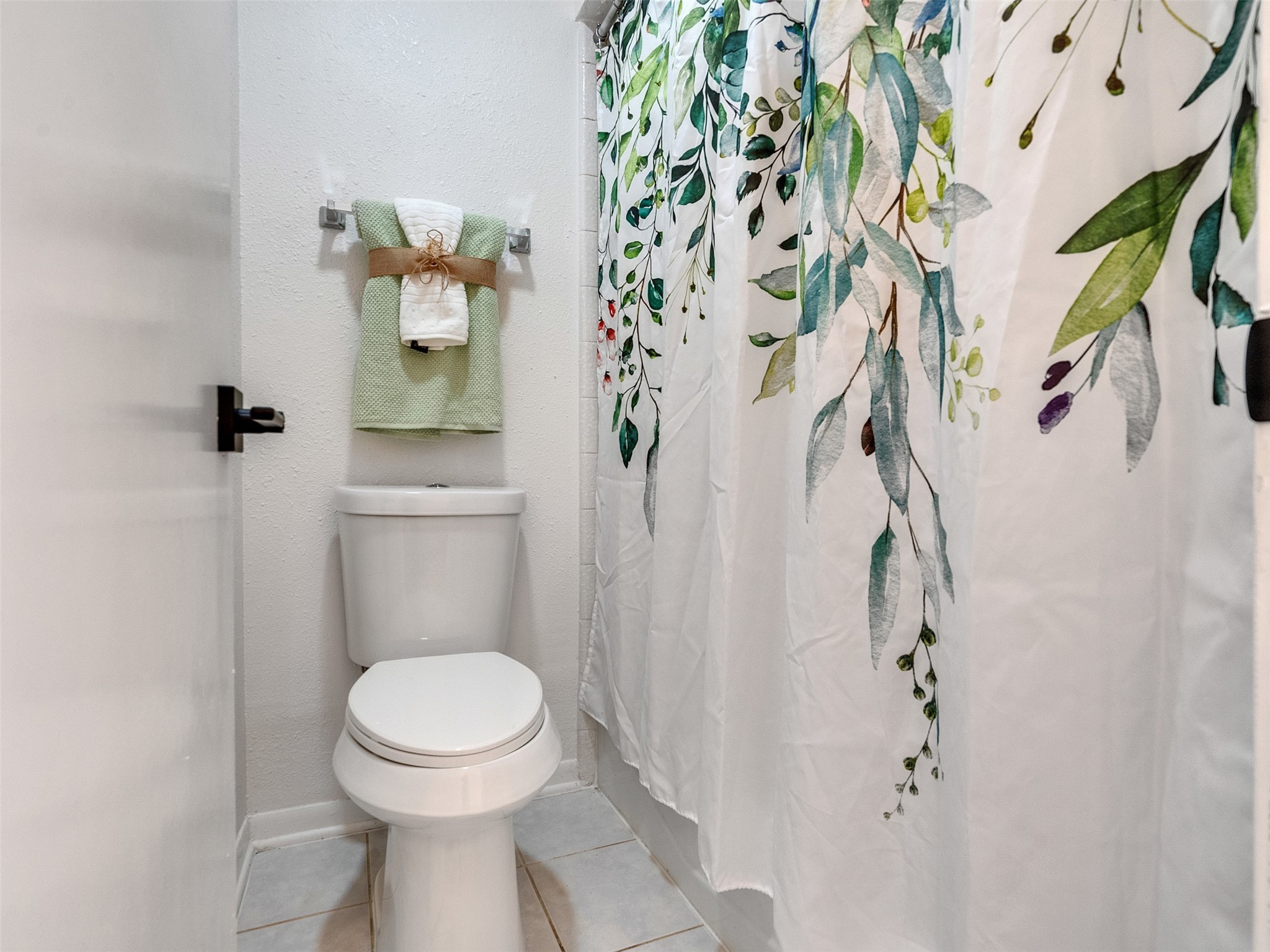 6510 Knollview Drive Spring, TX 77389 - Photo 38 of 43 a white toilet sitting next to a shower curtain