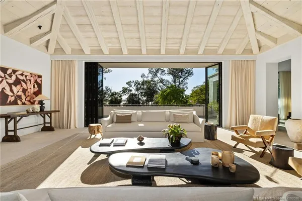 a view of balcony with couch and wooden floor