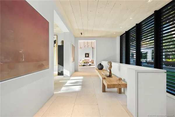 a kitchen with kitchen island a sink appliances and a counter top space