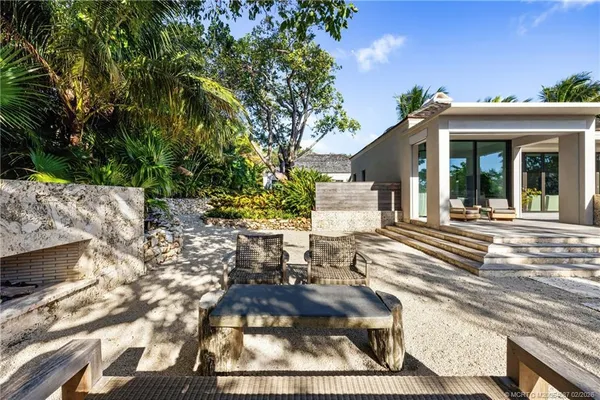 a living room with a large window and a table