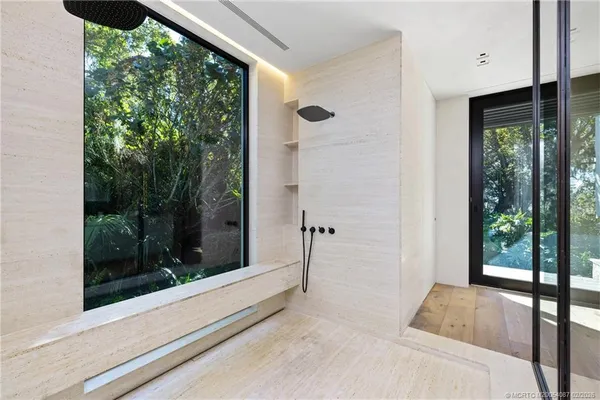 a bathroom with a double vanity sink and mirror