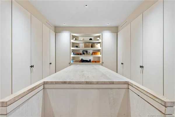 a kitchen with stainless steel appliances a refrigerator and a sink