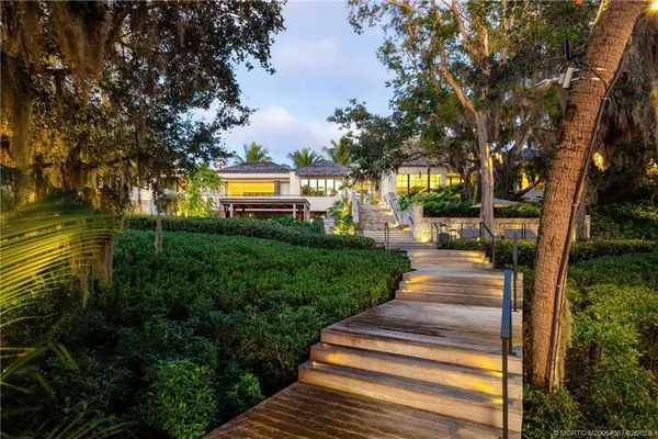 a view of a swimming pool with a yard