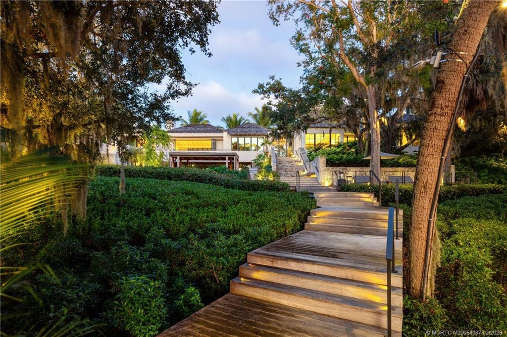 109 South River Road Stuart, FL 34996 - Photo 4 of 98 a view of a yard with plants and trees