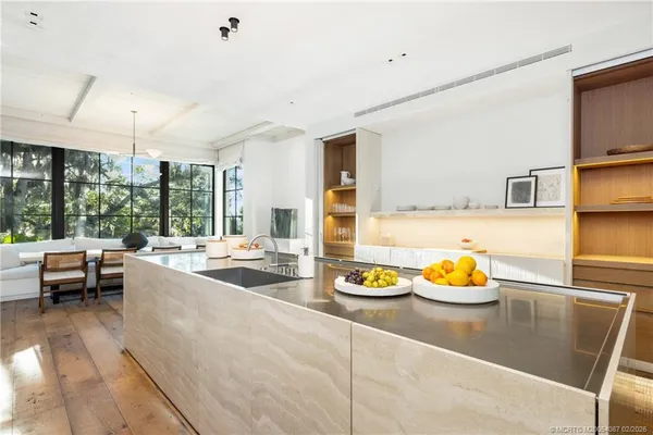 a view of a house with a flower garden