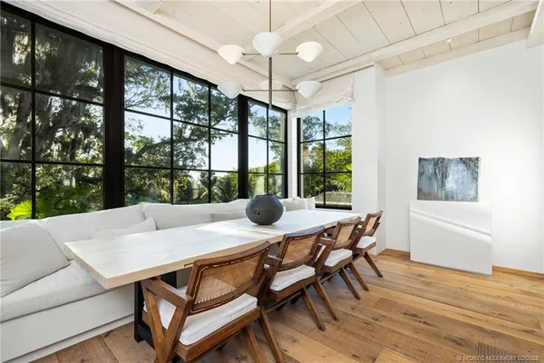 a backyard of a house with table and chairs