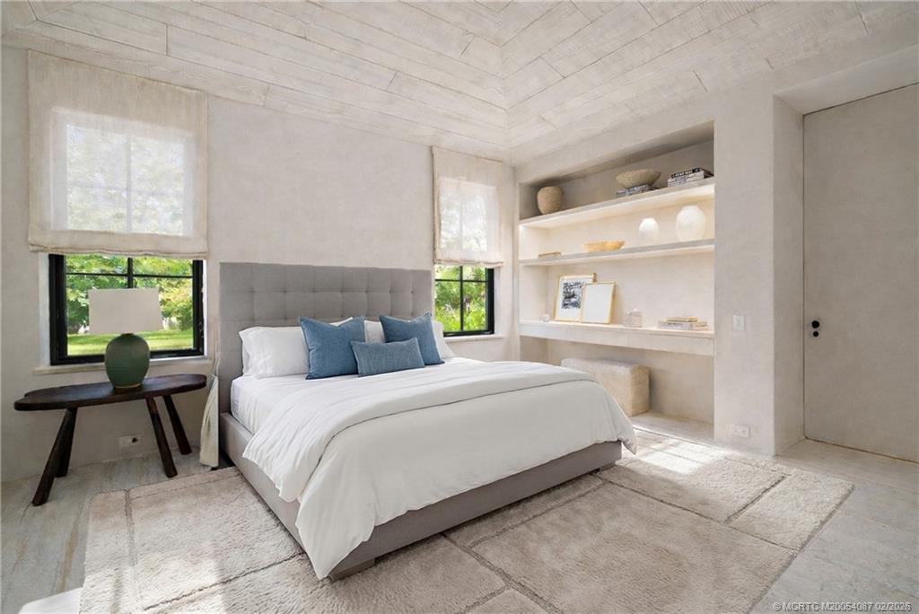 109 South River Road Stuart, FL 34996 - Photo 55 of 98 a bedroom with a bed and a window