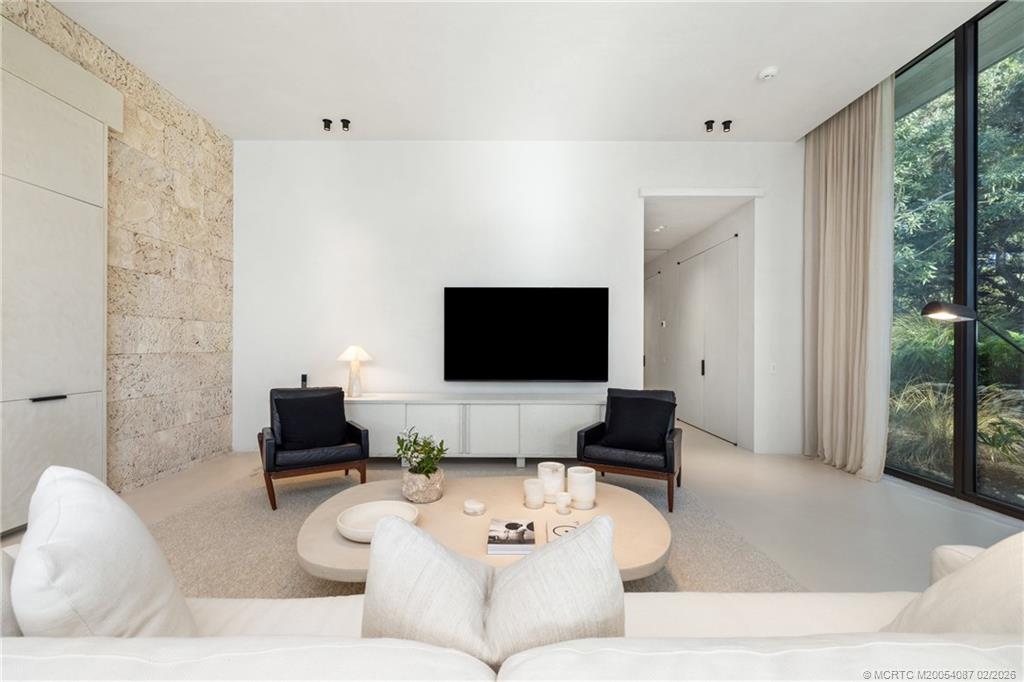 109 South River Road Stuart, FL 34996 - Photo 71 of 98 a living room with furniture and a flat screen tv