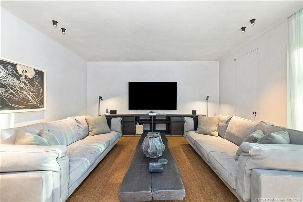 109 South River Road Stuart, FL 34996 - Photo 81 of 98 a living room with furniture and a flat screen tv