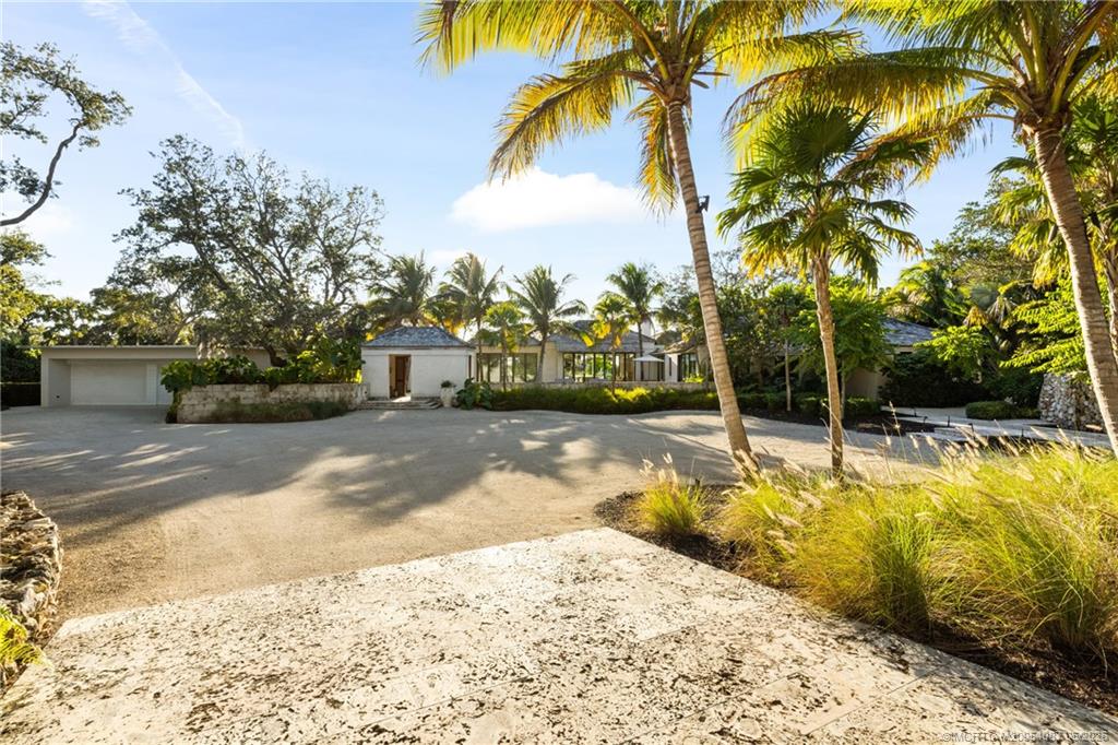 109 South River Road Stuart, FL 34996 - Photo 9 of 98 a view of a swimming pool with a yard