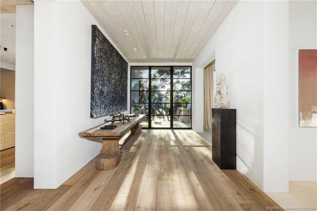 109 South River Road Stuart, FL 34996 - Photo 91 of 98 a view of a bedroom with a bed and wooden floor