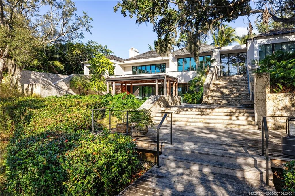 109 South River Road Stuart, FL 34996 - Photo 94 of 98 a view of a house with backyard and sitting area